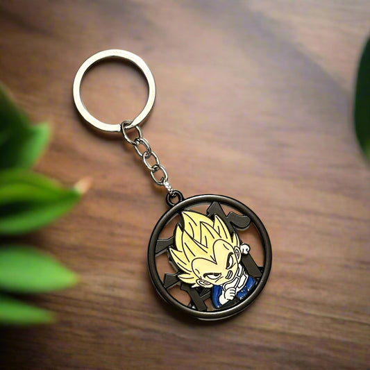 A Dragon Ball Z keychain featuring Super Saiyan Vegeta in a circular black metal frame with spiky yellow hair, placed on a marble-textured hexagonal tile background.